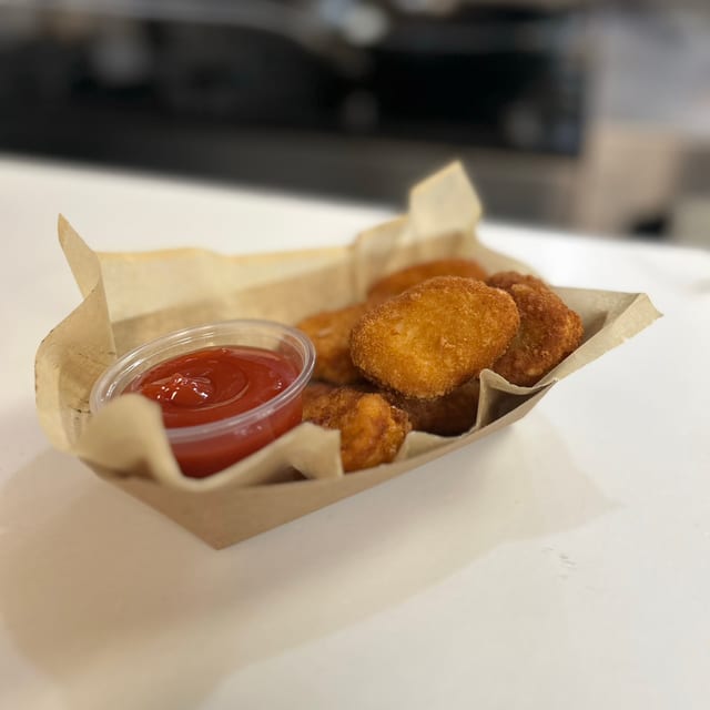 (6) CHICKEN NUGGETS.